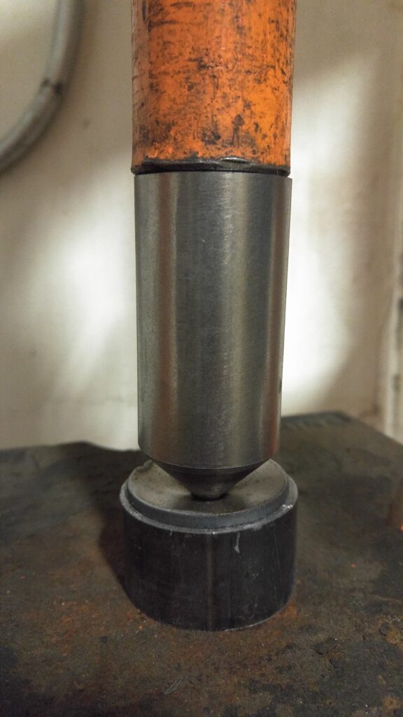 The punch and die loaded in the press