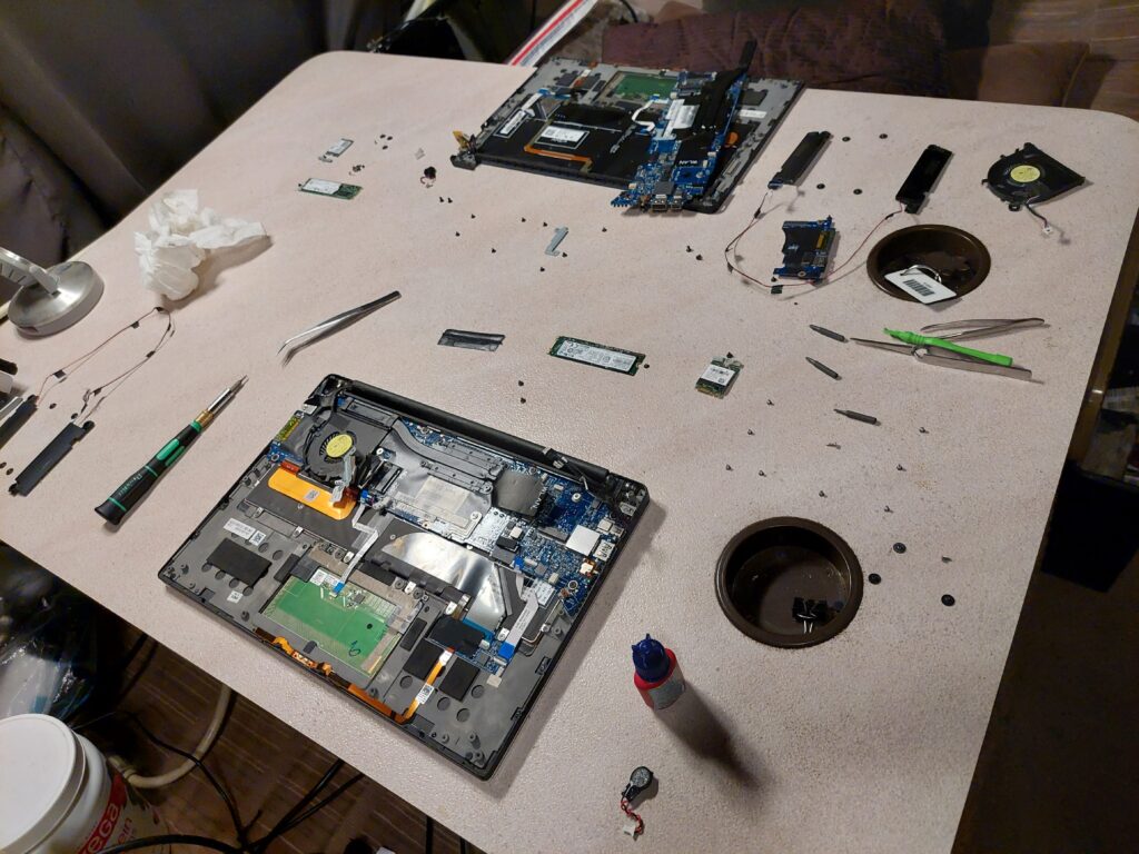 An opened Dell XPS 13 laptop from above, internals exposed and orderly
