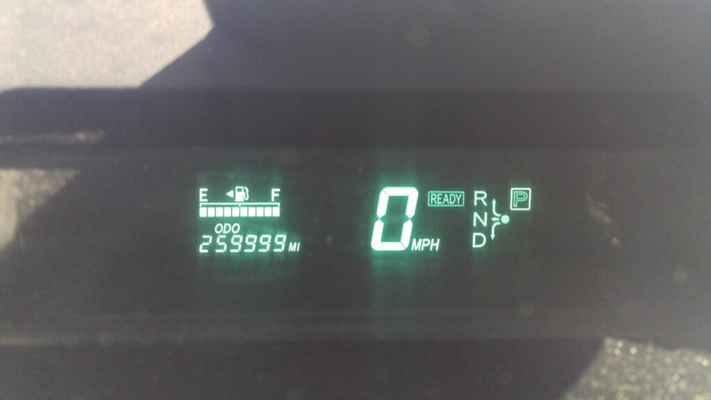 The instrument cluster of a 2004 Prius reading an odometer value of 259,999 miles, with the READY indicator lit