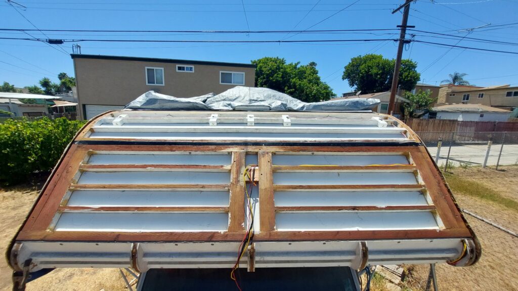 The rebuilt cabover from the front, new framing members set across the opening before the outer skin goes back on